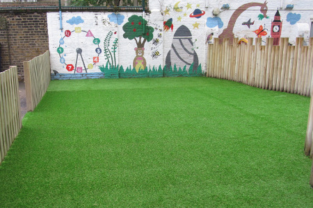 London old car park made in to a small play area with artificial grass